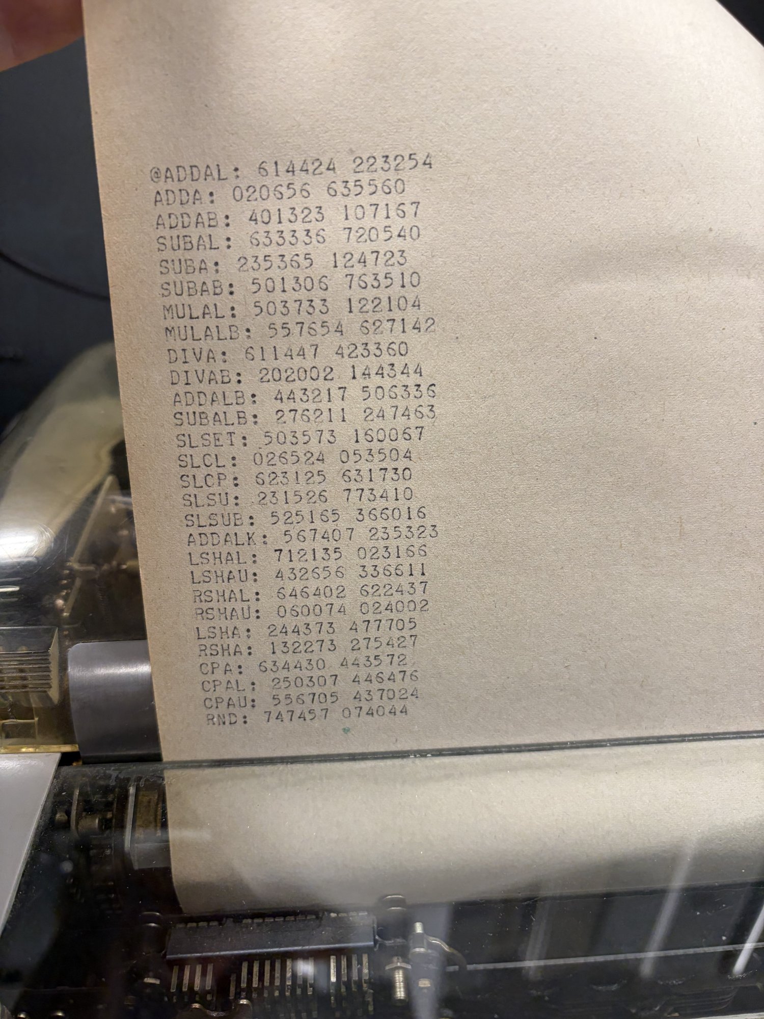 Teletype output listing one opcode per line, each followed by an octal hash.
