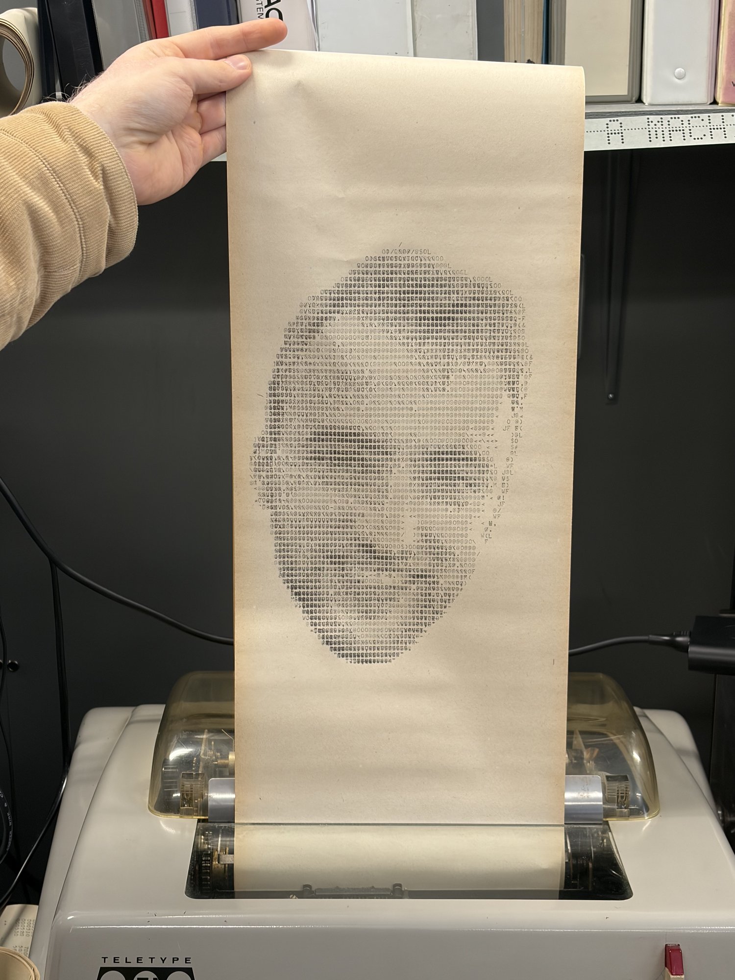 An ASCII portrait of Nathan printed on the teletype.