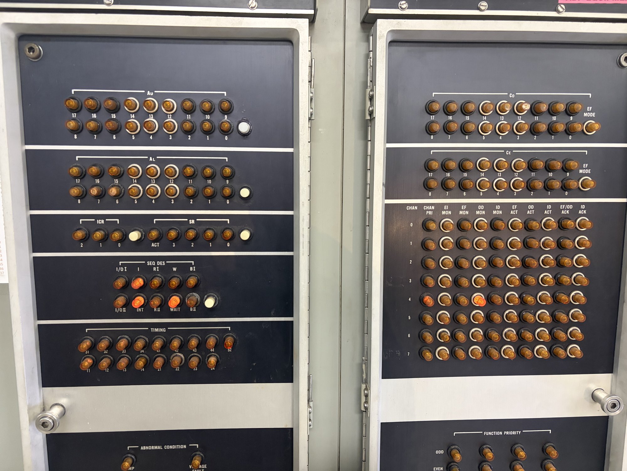 The UNIVAC indicator panels with one lamp lit on the channel 4 row.